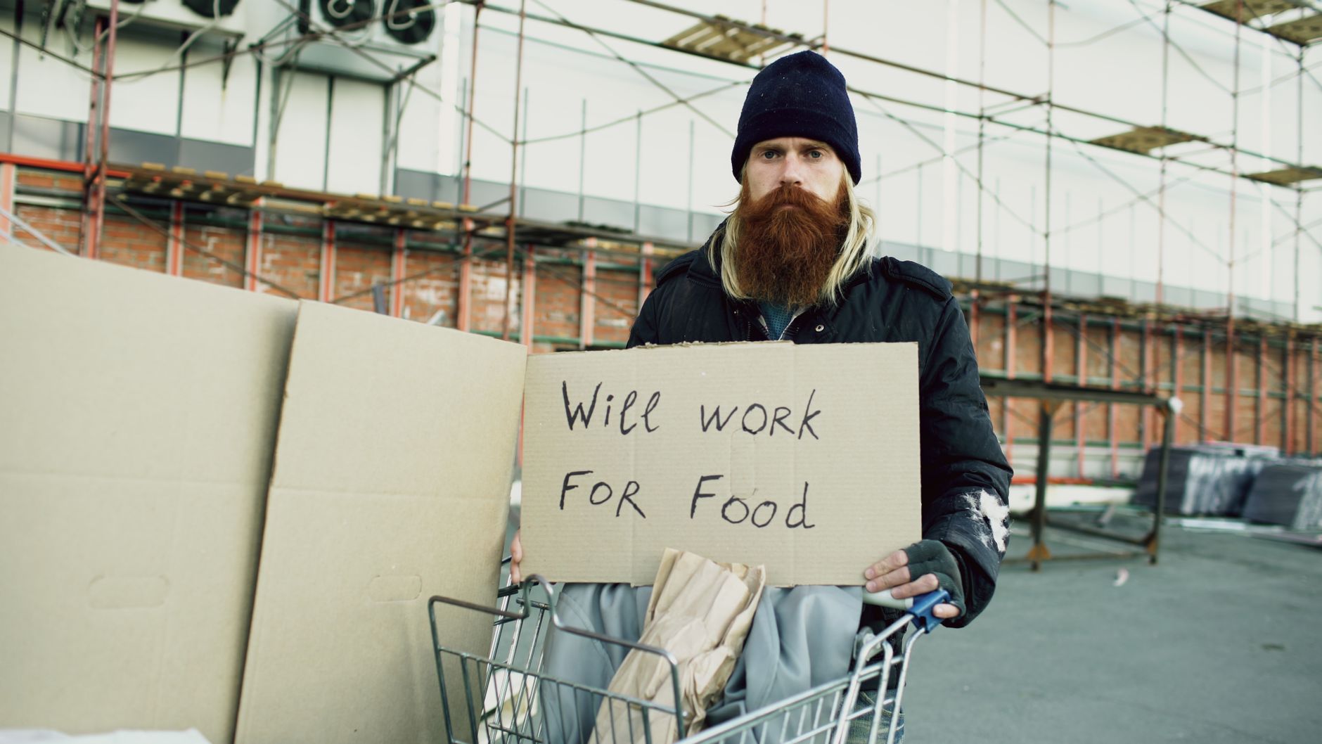 A person helping a neighbor with groceries, showing the difference between Zakat and Sadaqah.