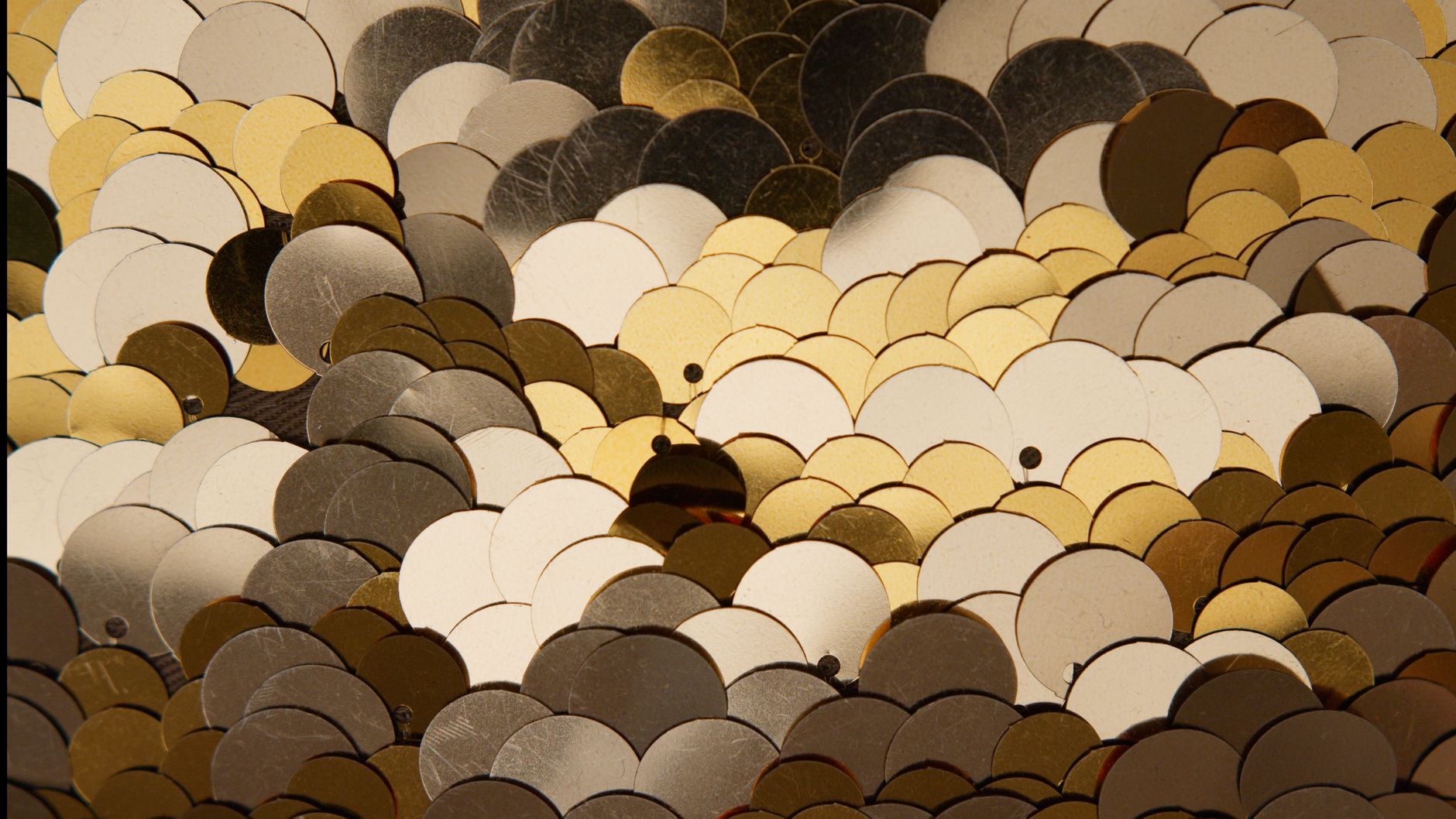 A set of brass scales used for weighing Zakat on gold and silver accurately.