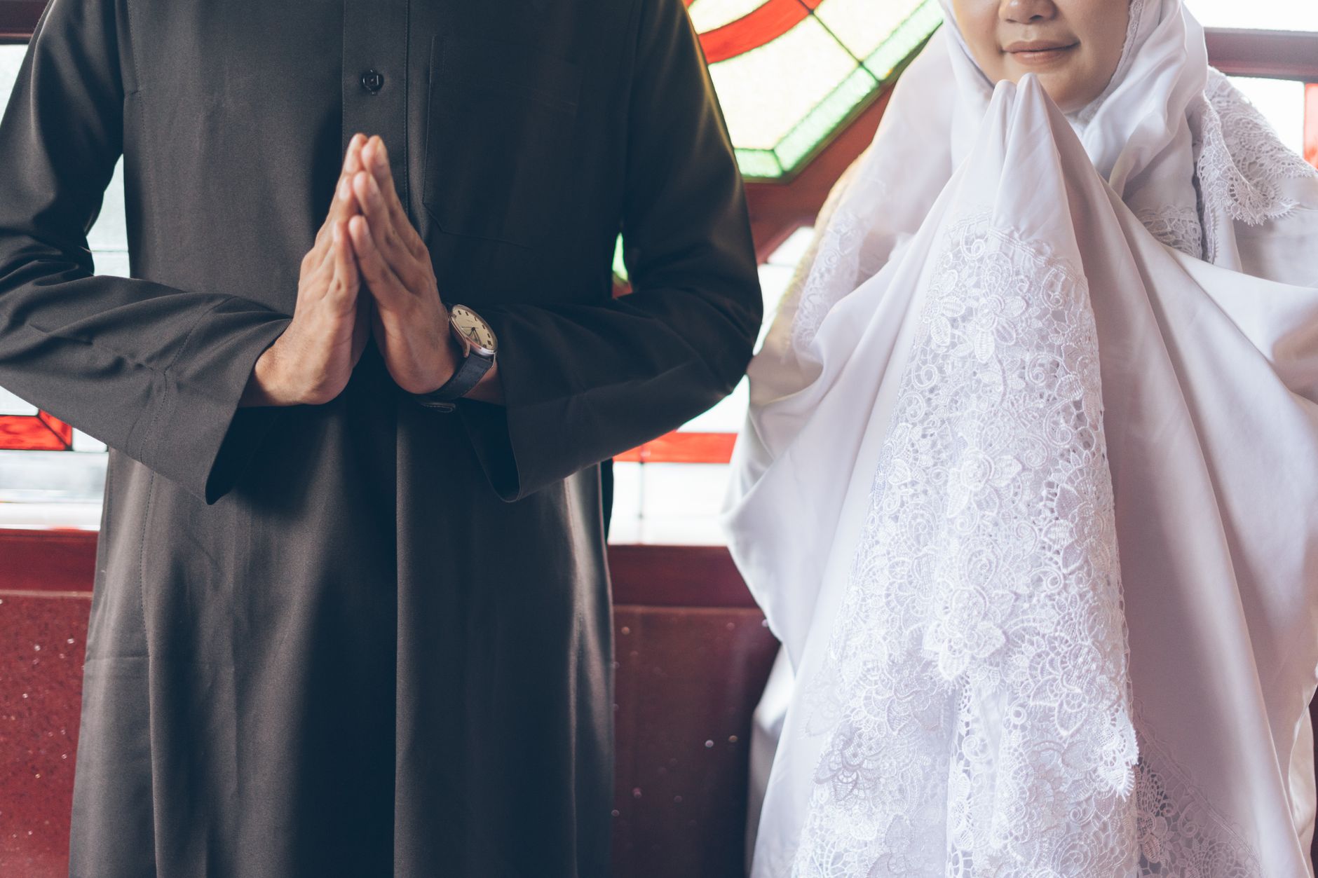A husband and wife sharing a kind moment at home to demonstrate kindness between spouses.