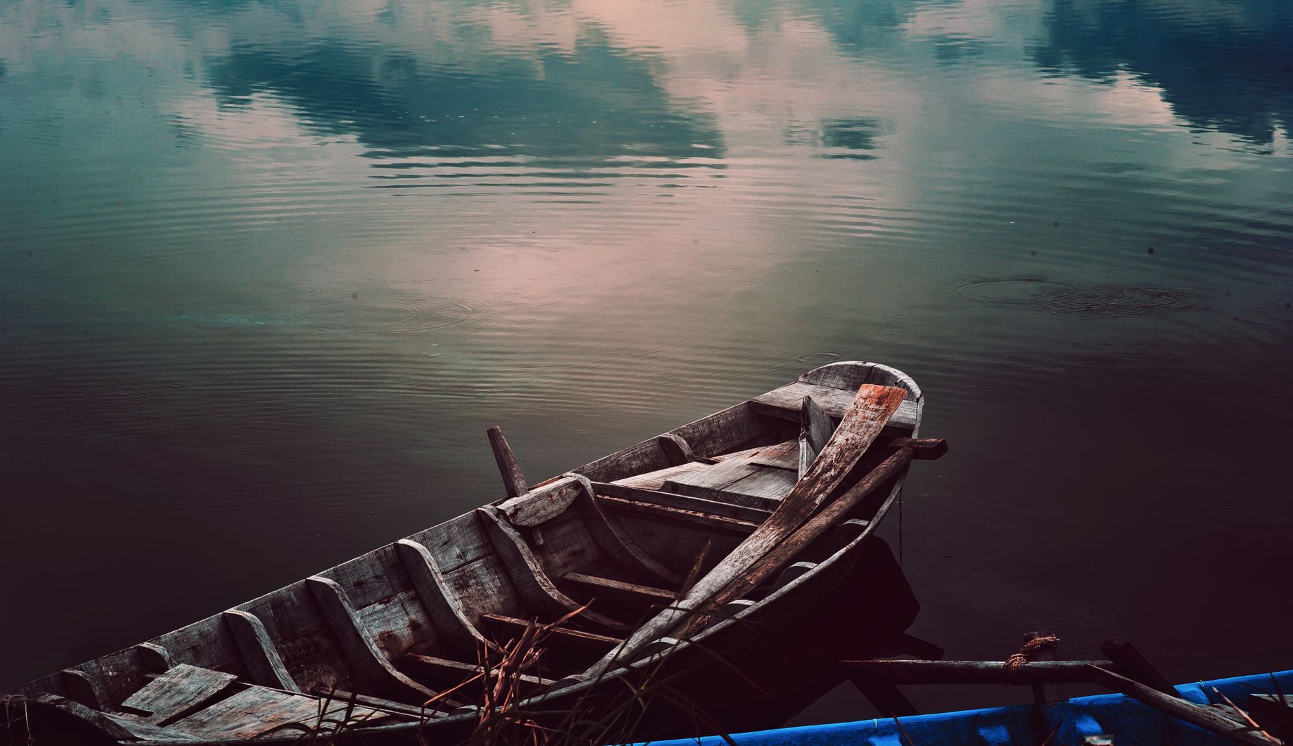 A traditional wooden boat on water representing the life of prophet nuh.