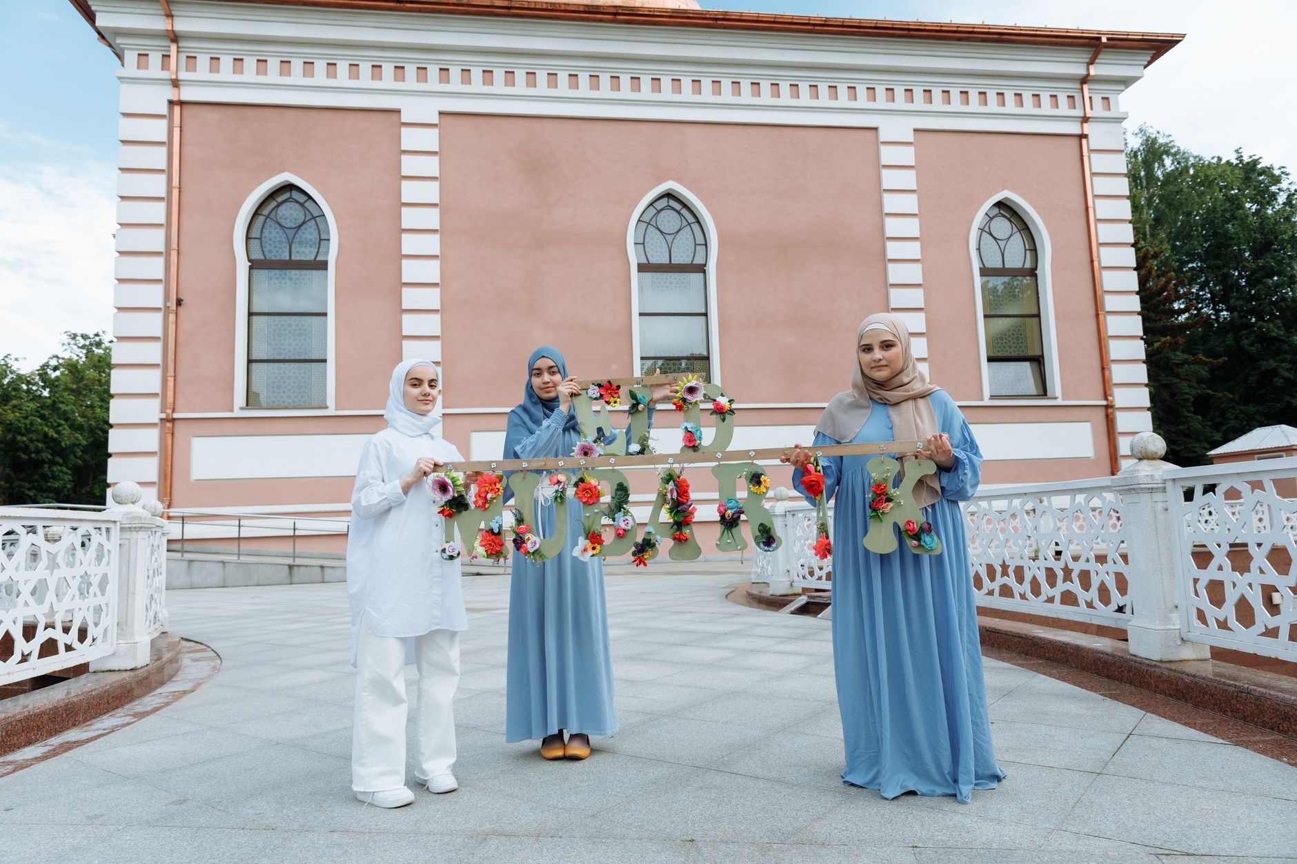 A person helping a neighbor to demonstrate the importance of Muslim unity in action.
