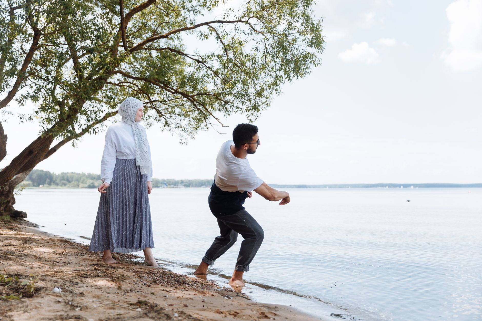 A Muslim couple praying together to strengthen their bond through kindness between spouses.