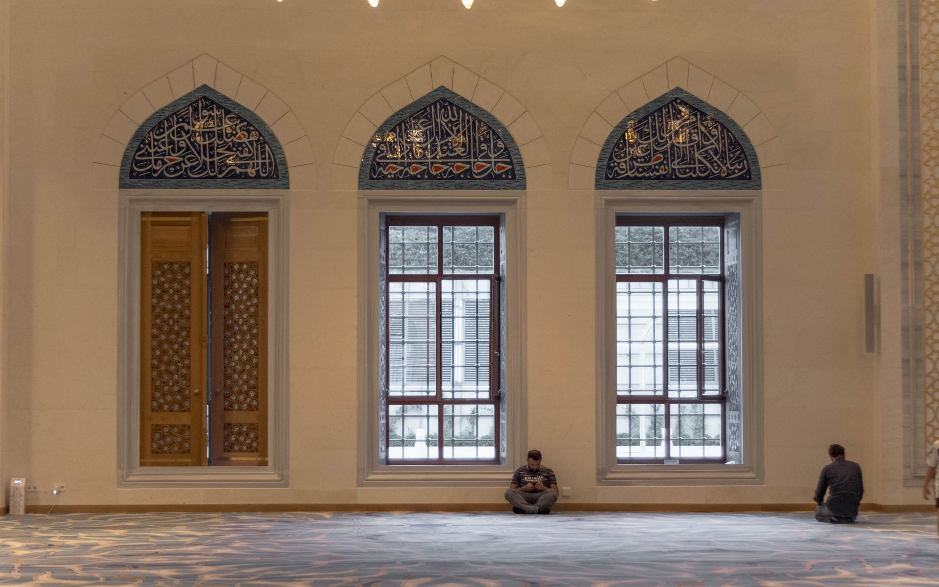 A calm and historic mosque interior reflecting the patience of Prophet Ayyub.