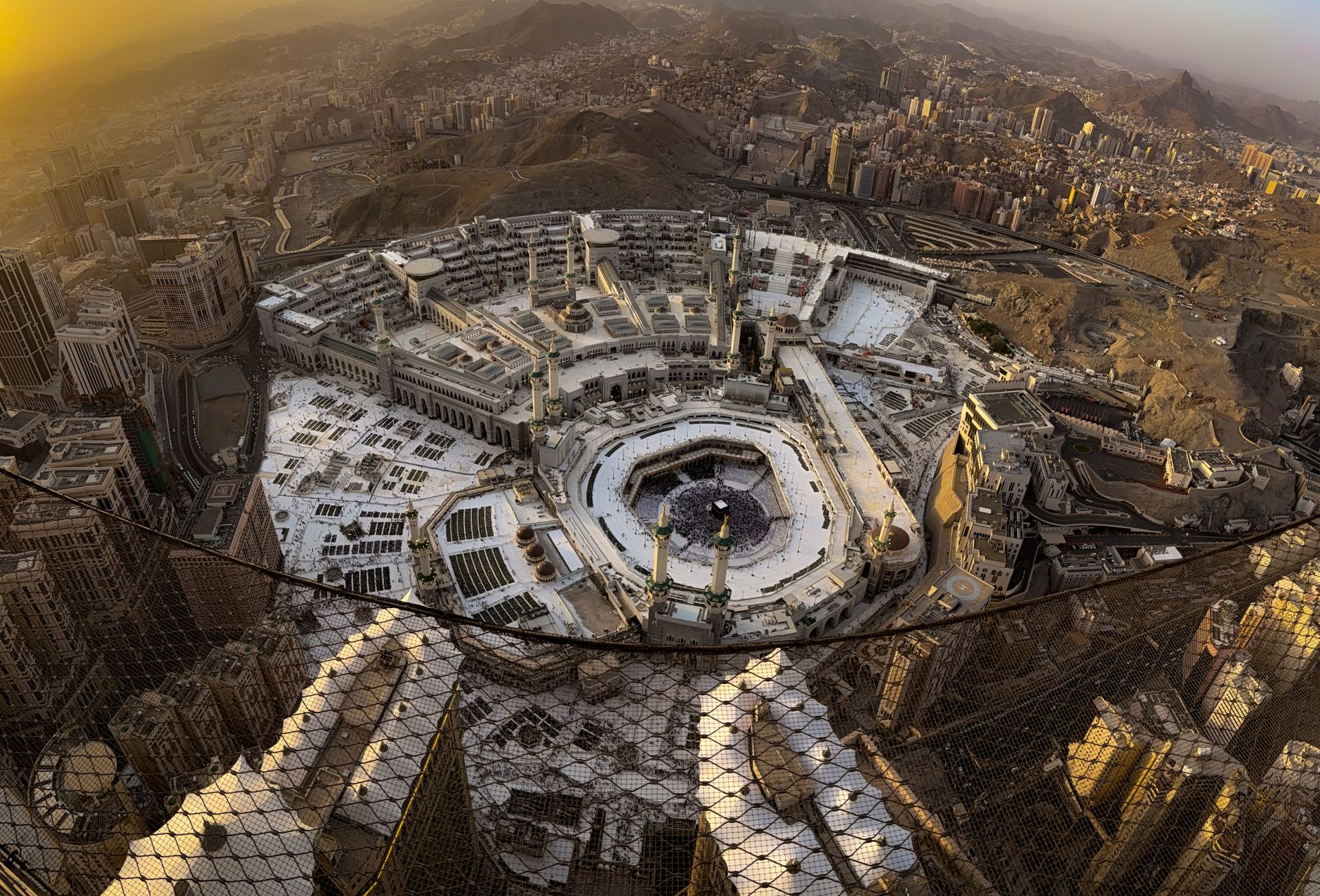 A person reading the Quran with focus on the Day of Arafah in a quiet room.