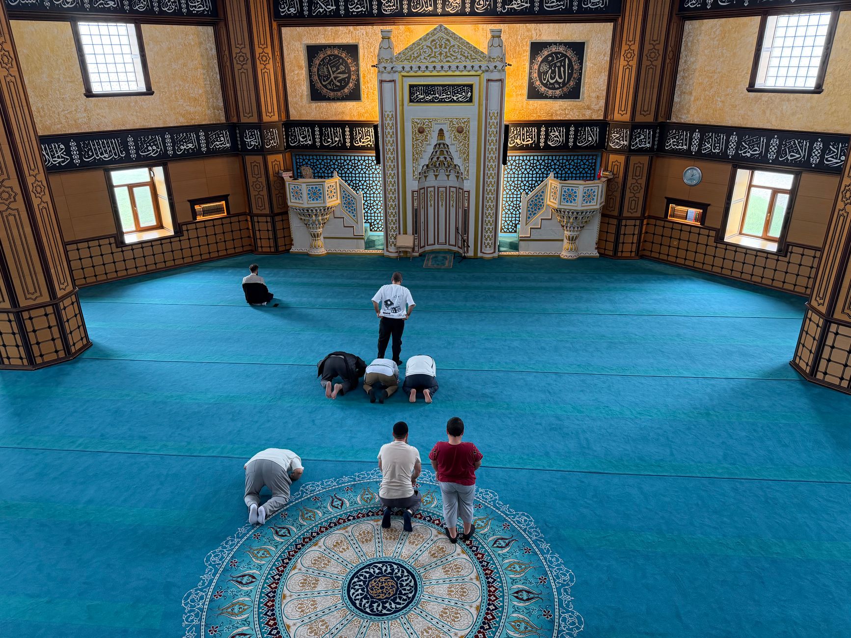 A peaceful mosque interior where a Muslim reflects on the meaning of Qadr in Islam.