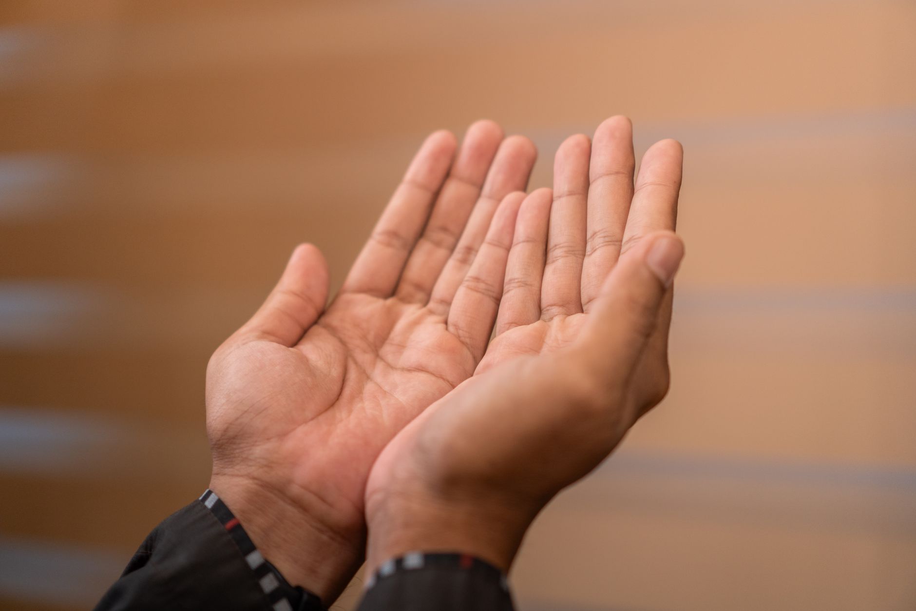 A person reading the Quran, reflecting on the importance of Dua and spiritual growth.