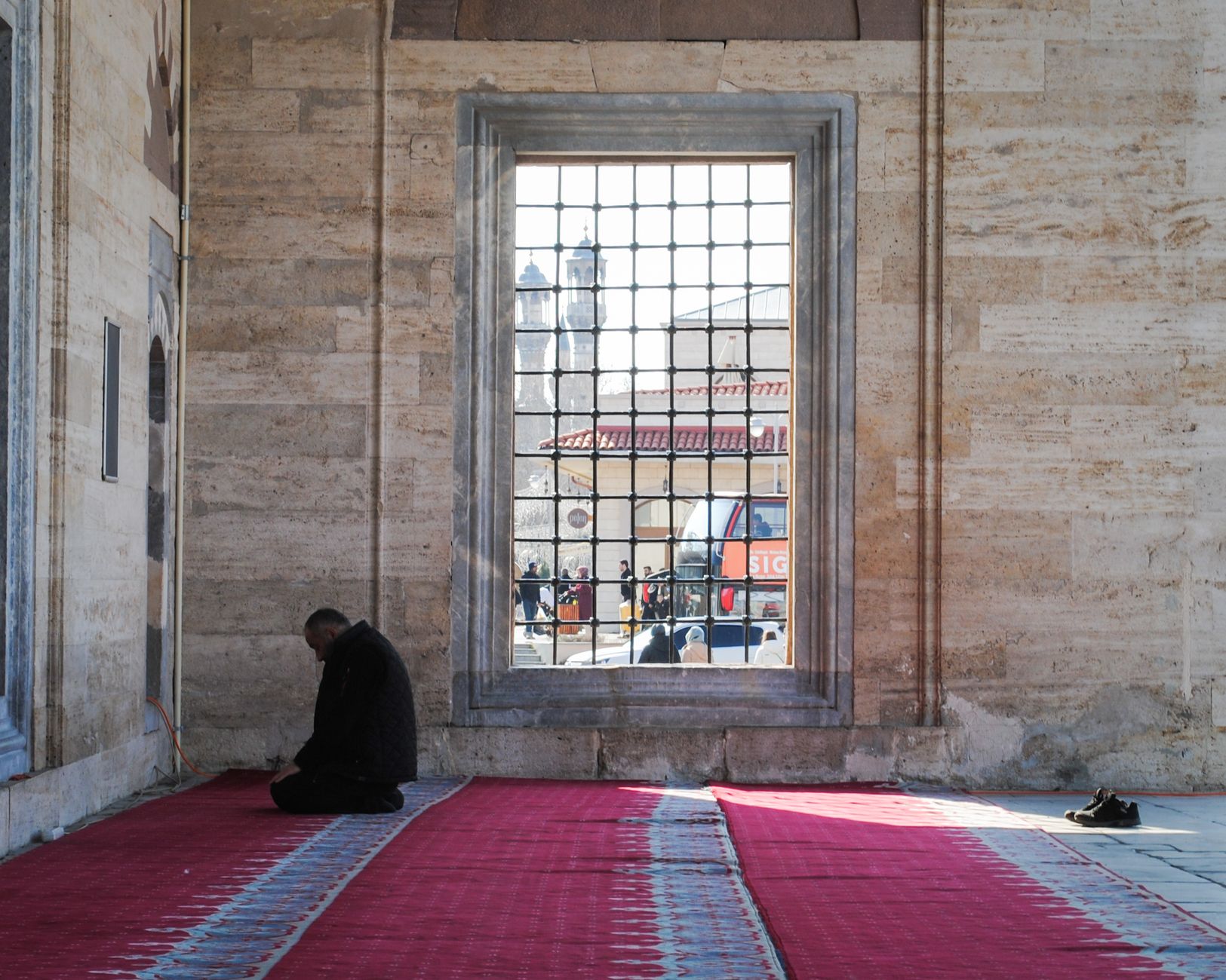 A person reading the Quran to prepare for death in Islam with full focus and peace.