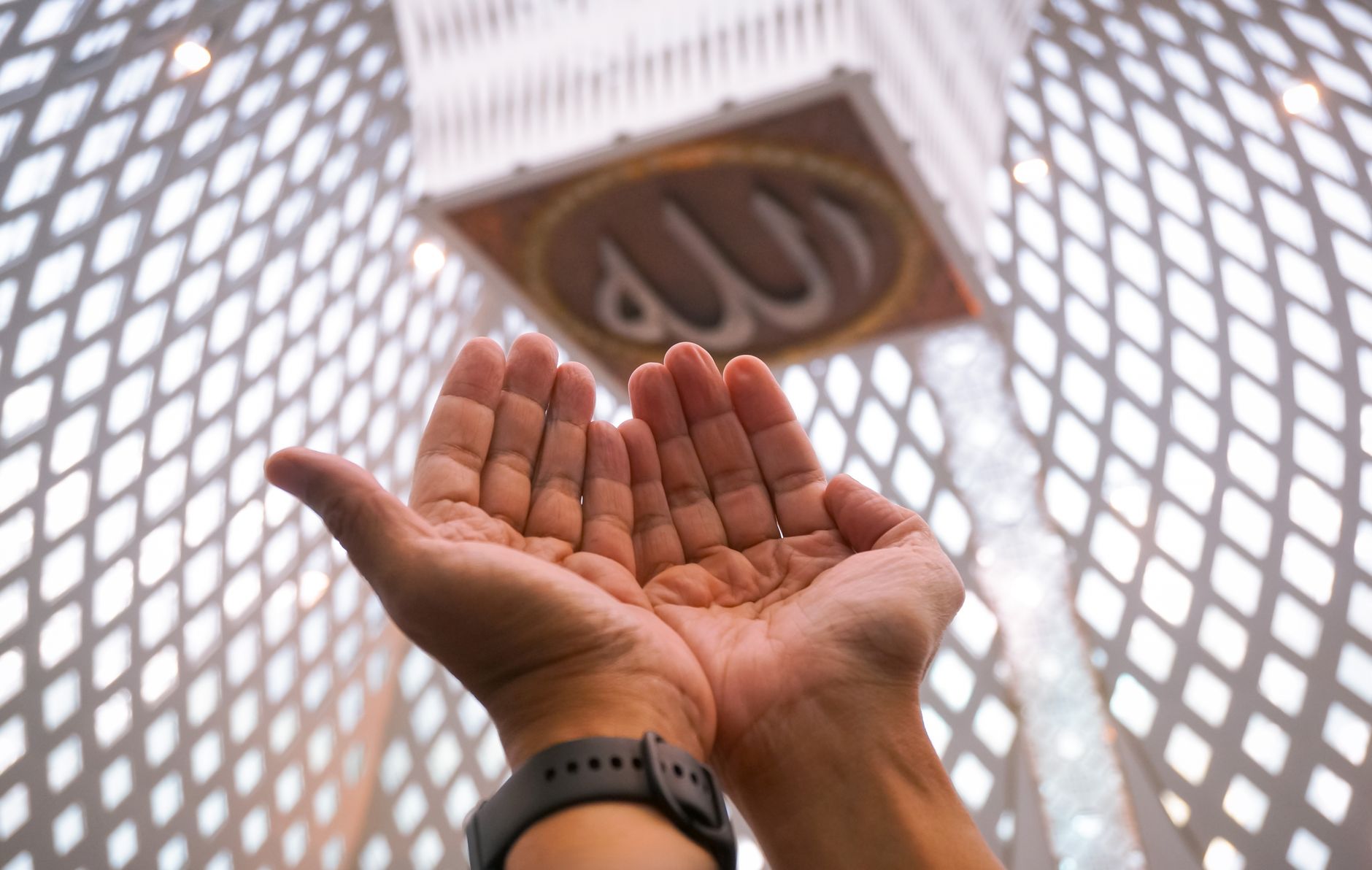 A peaceful mosque interior where a believer recites Ayatul Kursi for protection.