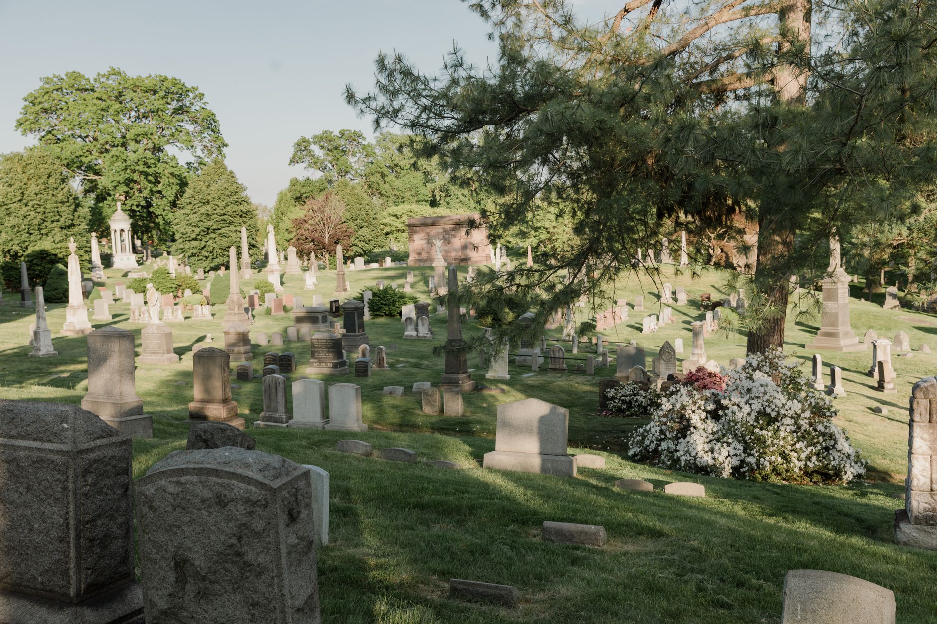 A person reading the Quran as part of the Islamic funeral process and remembrance.