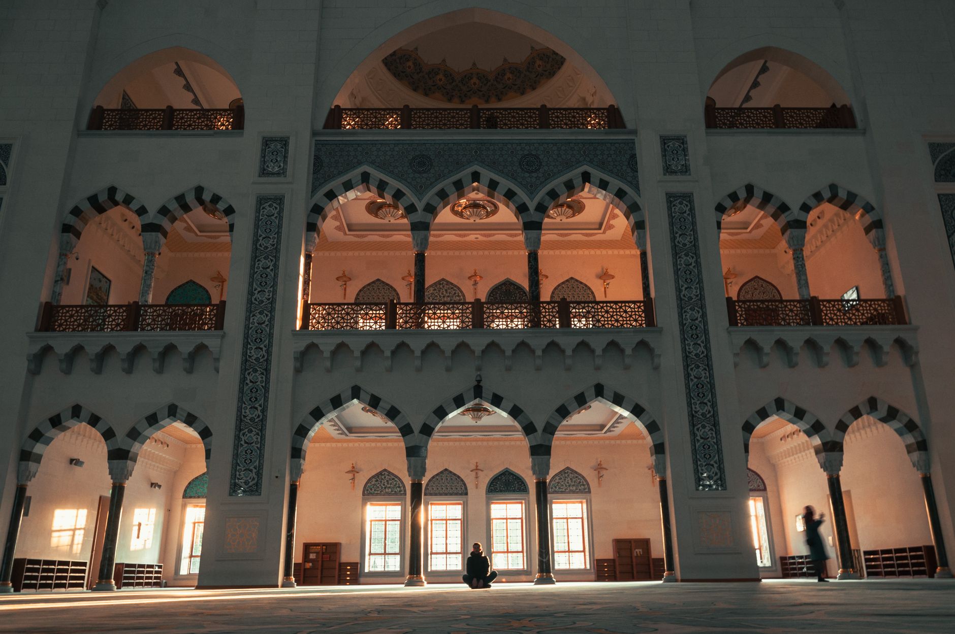 An interior view of a historic mosque highlighting the tradition of learning associated with Abdullah ibn Masud.